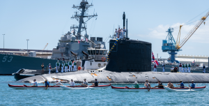 Members of the Outrigger Canoe Club escort the Virginia-class fast attack submarine USS Hawaii (SSN 776) as it arrives, June 6, 2019, at Joint Base Pearl Harbor-Hickam after completing its latest deployment. Photo By: MC1 Daniel Hinton.